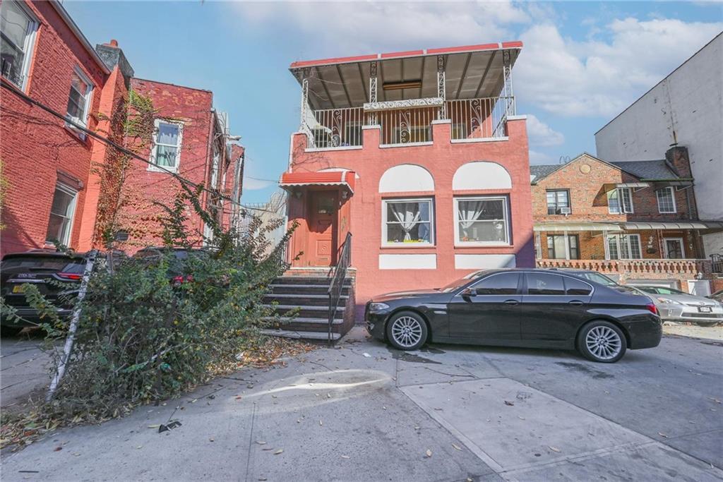 a front view of a house with parking space