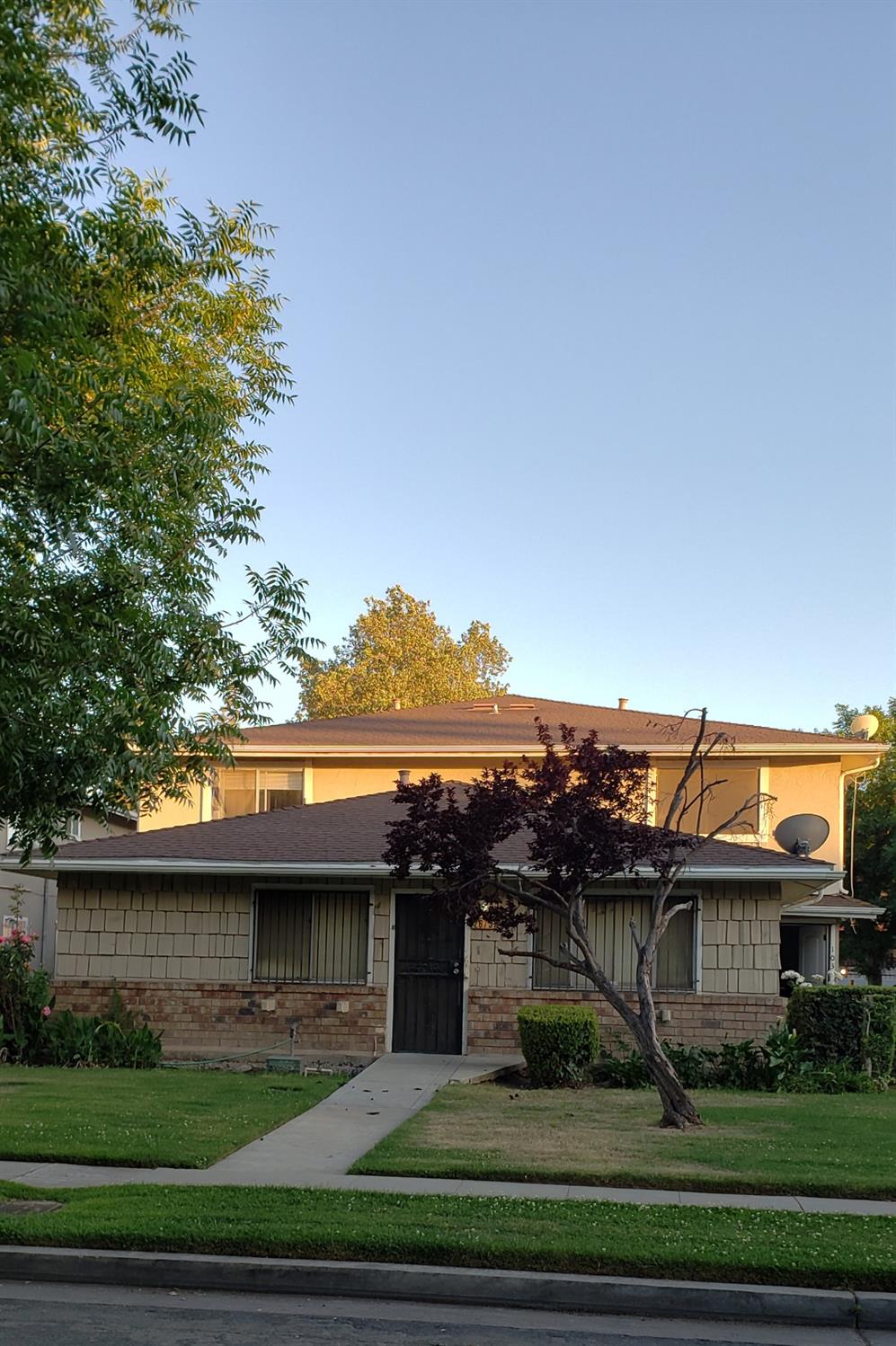 an outdoor view of house with yard