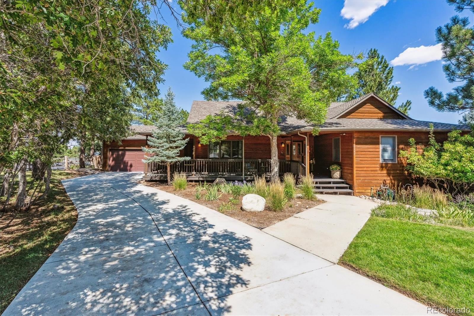 a view of a house with backyard porch and sitting area