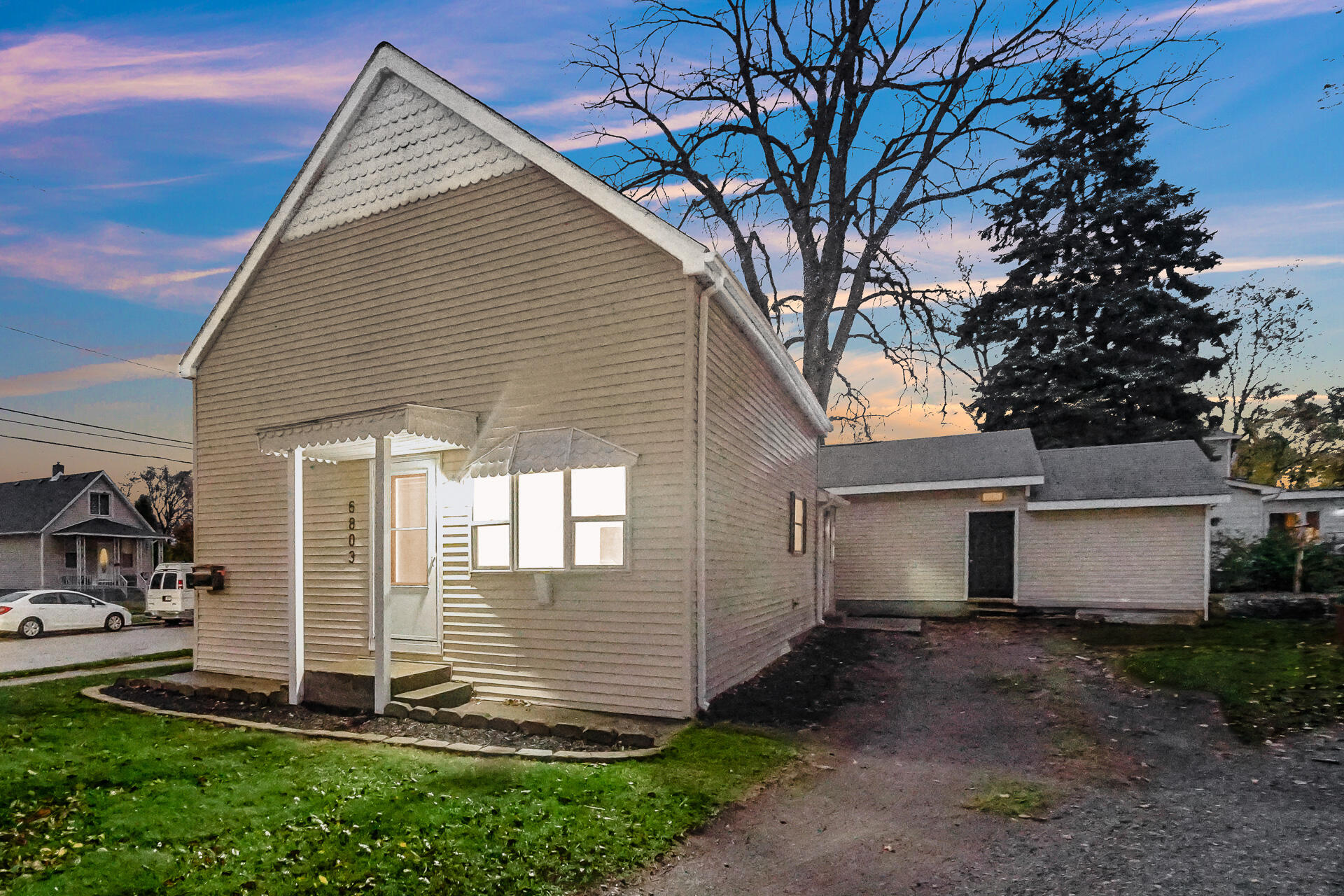 a view of a house with a yard