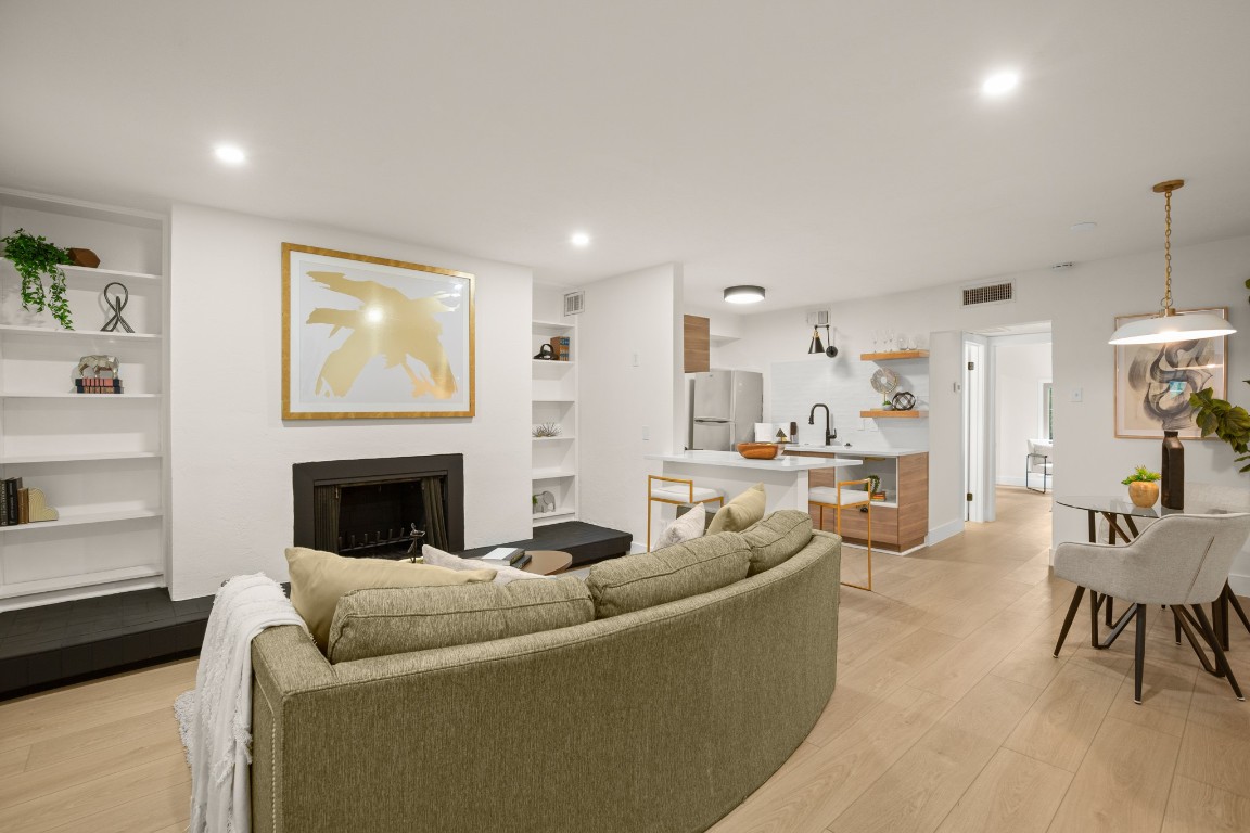 a living room with furniture and a fireplace