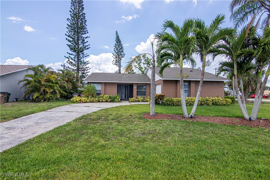 a front view of house with yard and green space