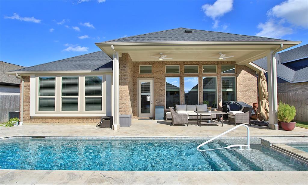 a view of a house with sitting area and garden