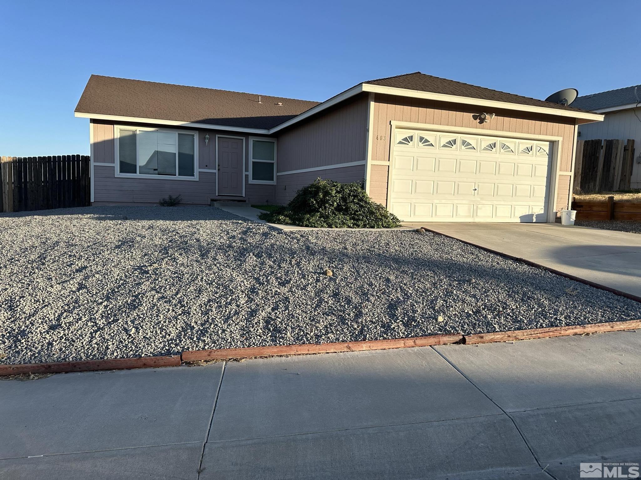 a front view of house with garage and yard