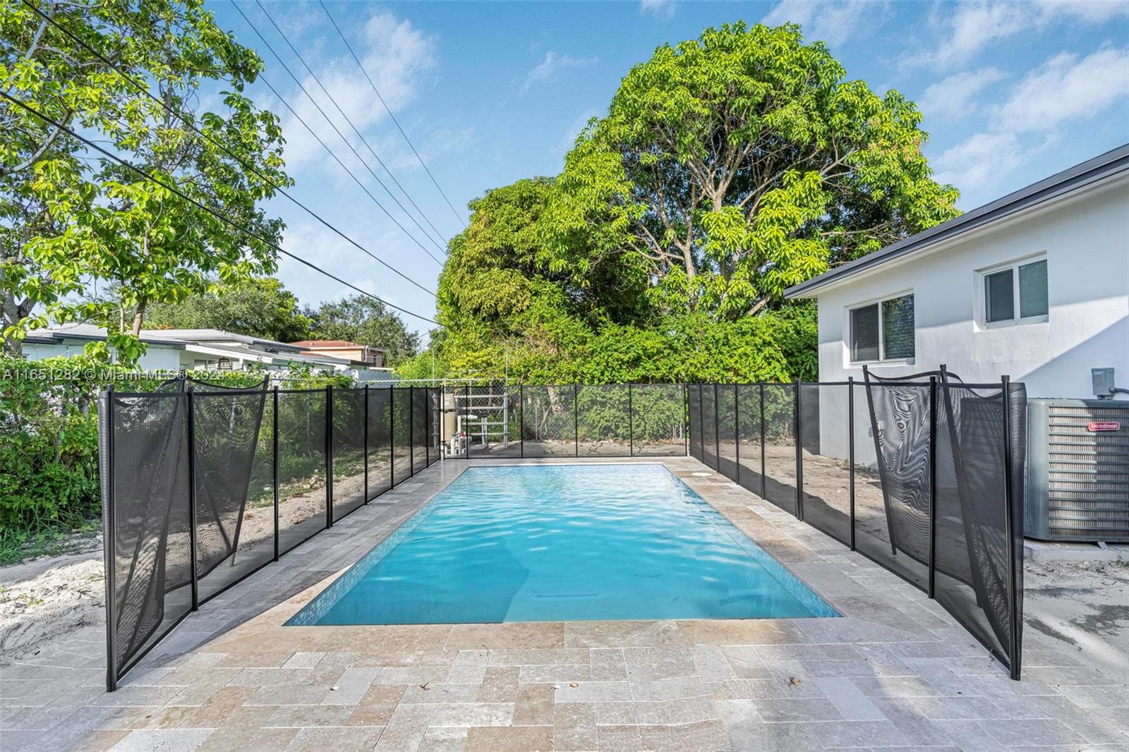 a view of backyard with green space