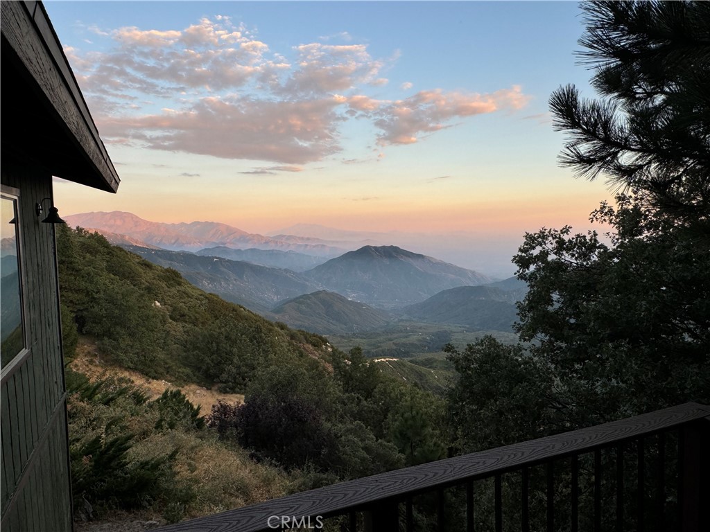 a view of a yard with a mountain