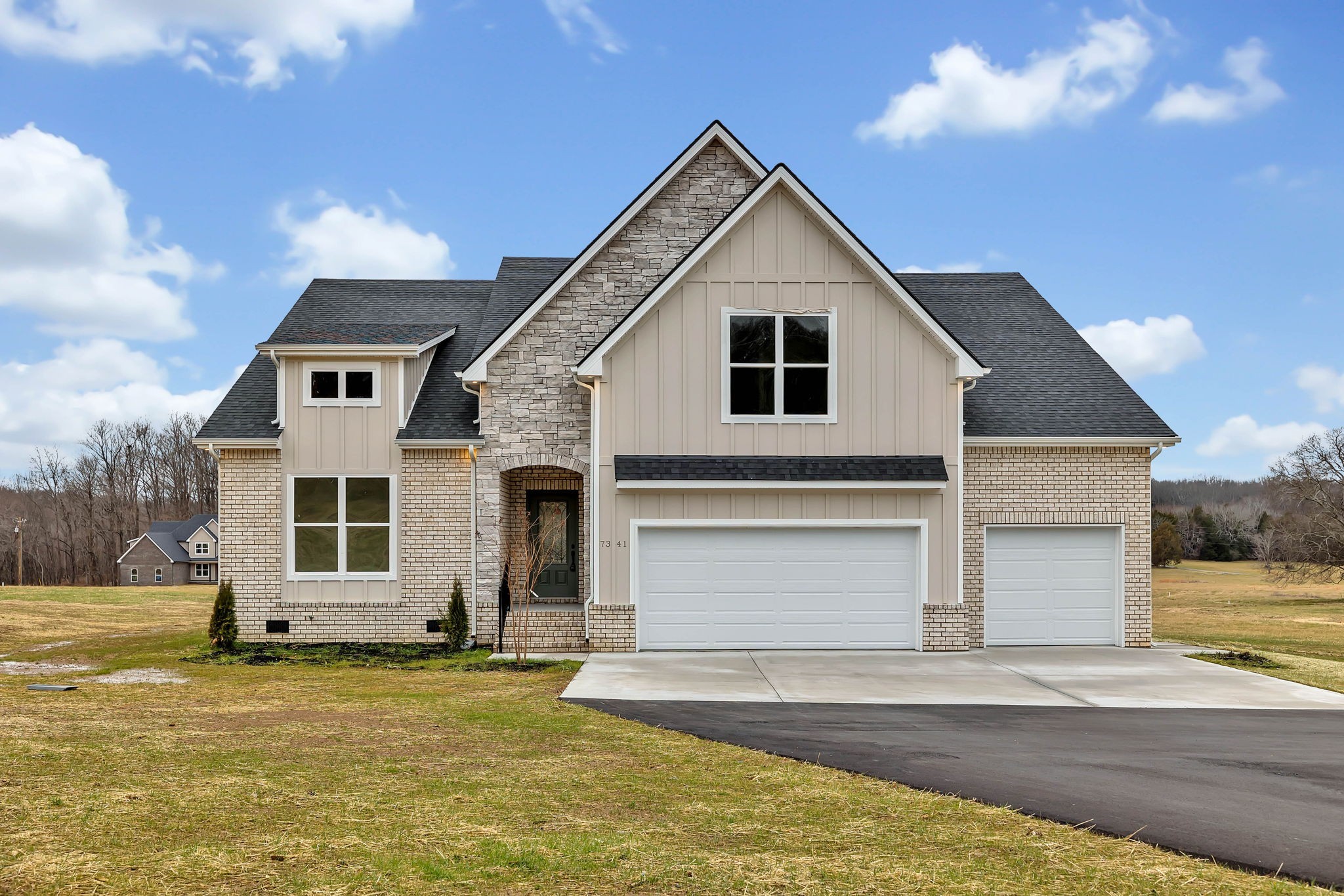 a front view of a house with a yard