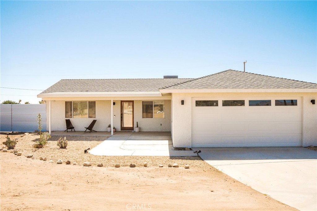 a front view of a house with a outdoor space