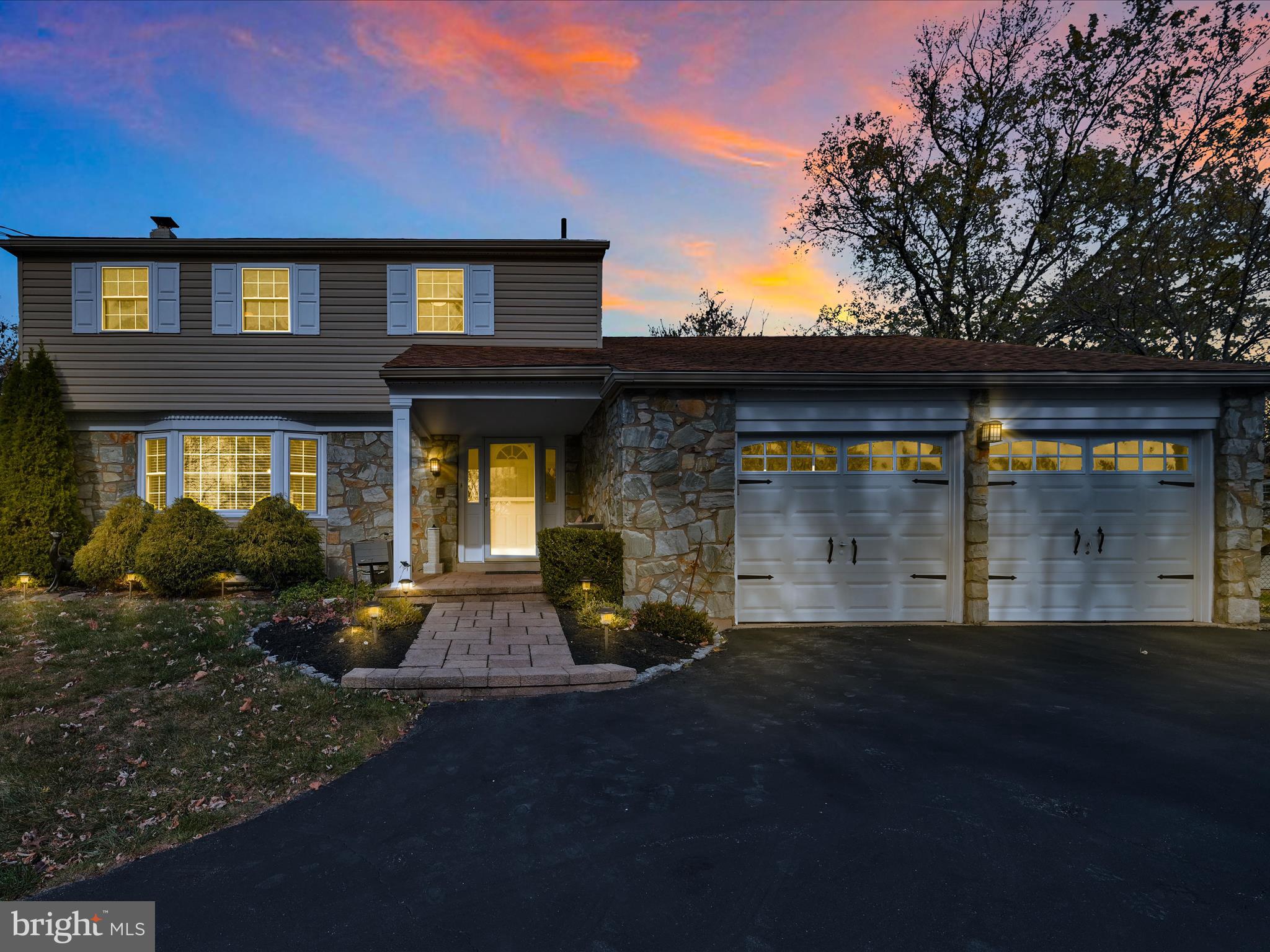 a view of a brick house with many windows