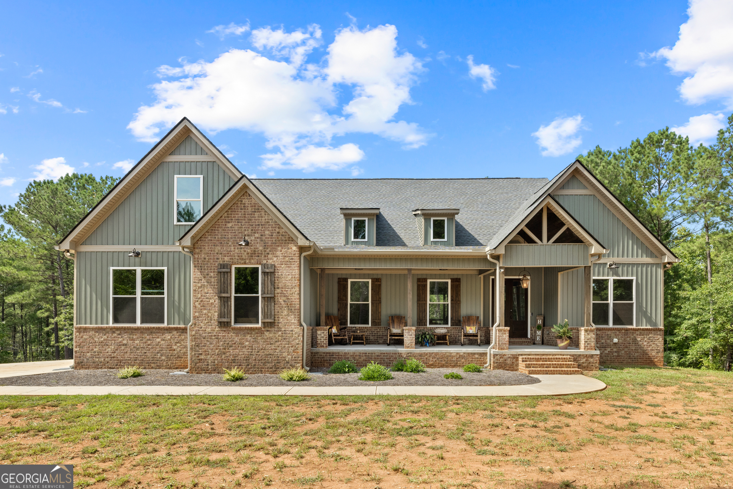 a front view of a house with a yard