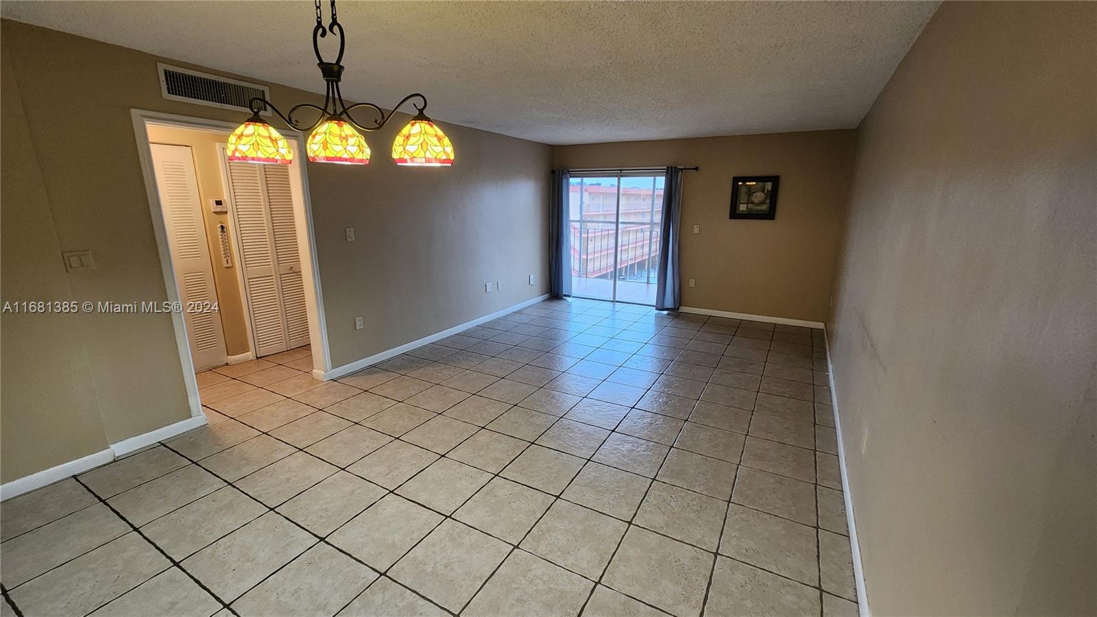 a view of an empty room and window