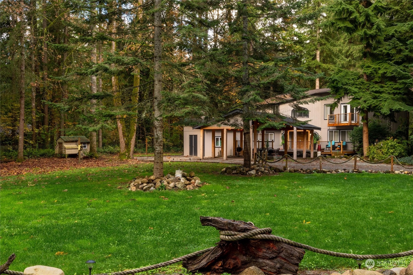 a view of a house with backyard sitting area and garden