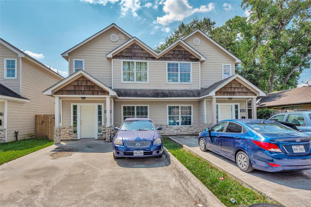 a front view of a house with parking space