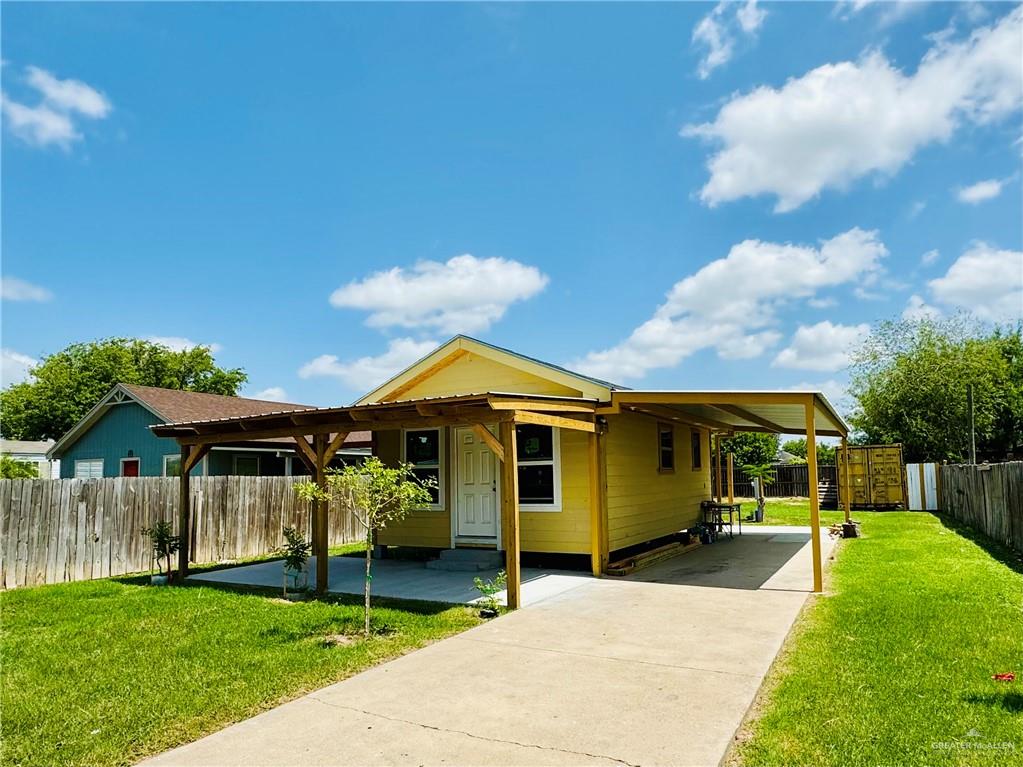 a front view of a house with a garden and porch