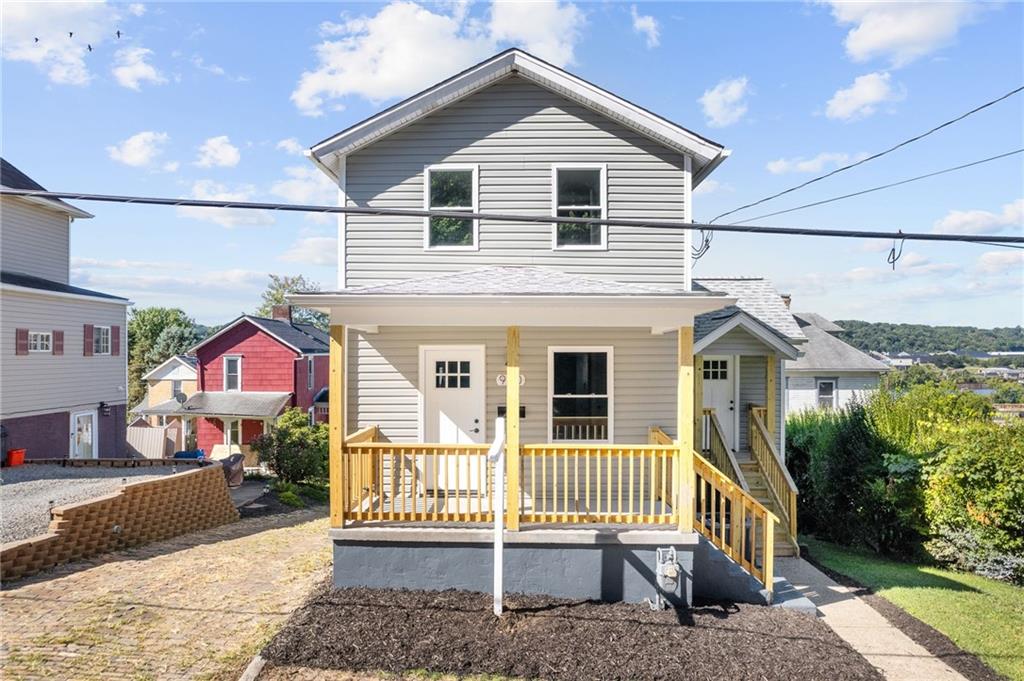 a front view of a house with a porch