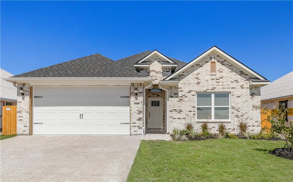 View of front of property with a front yard