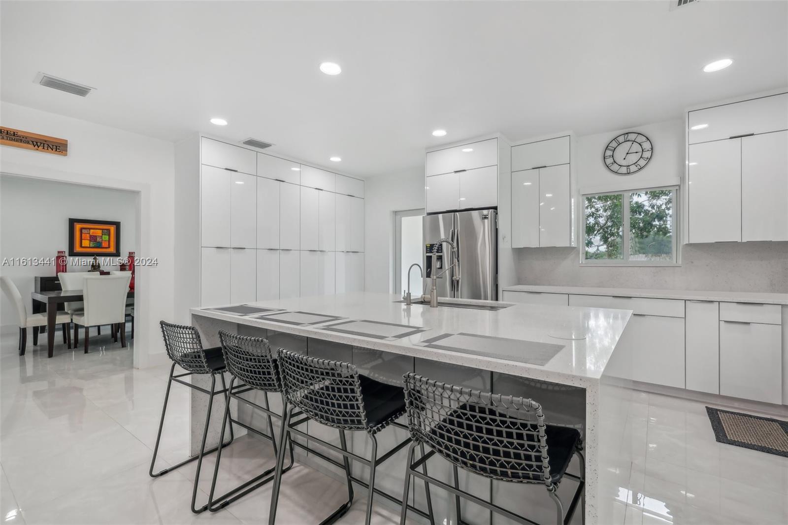 a kitchen with a table and chairs in it