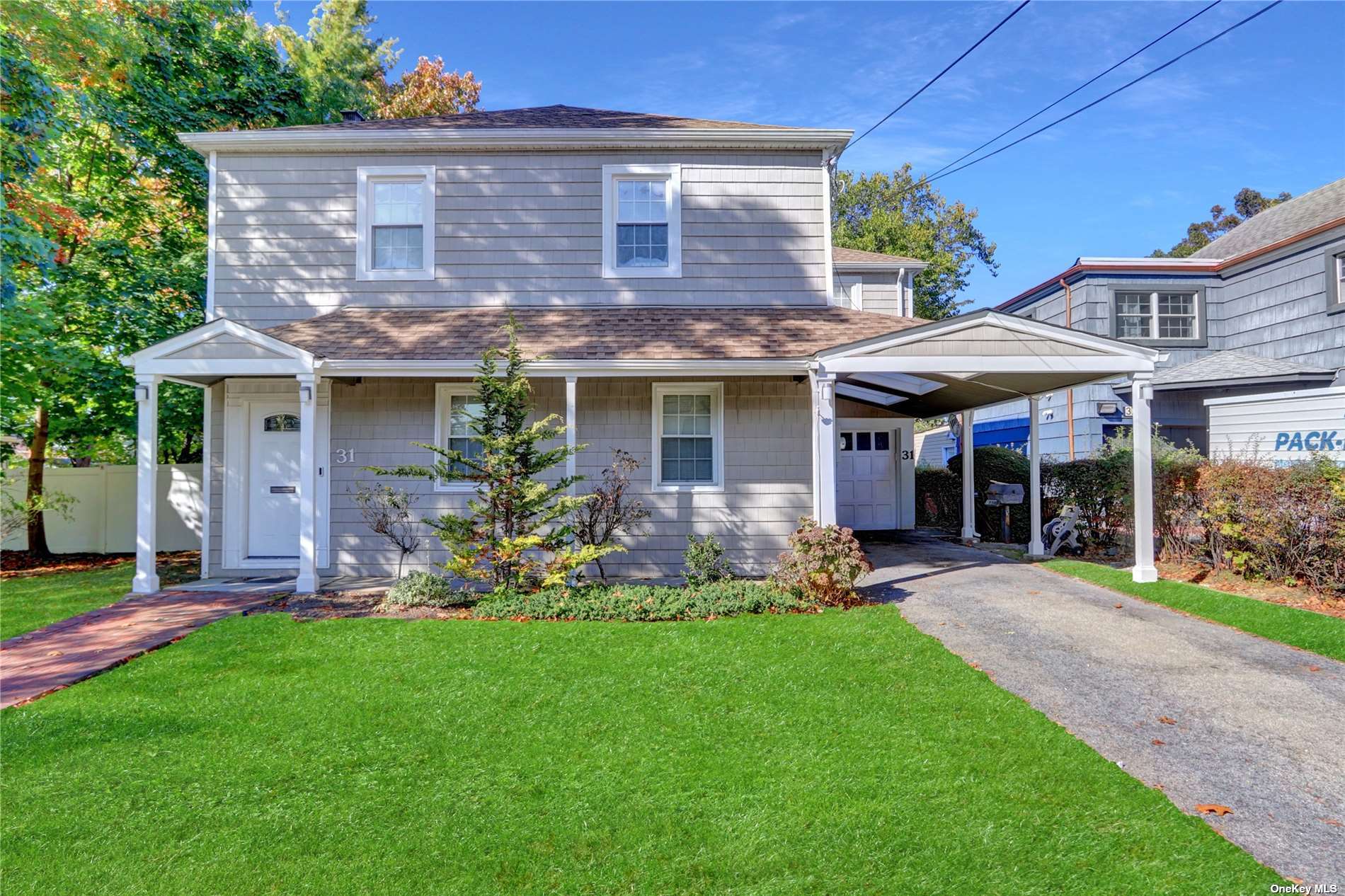 a front view of a house with a garden and porch