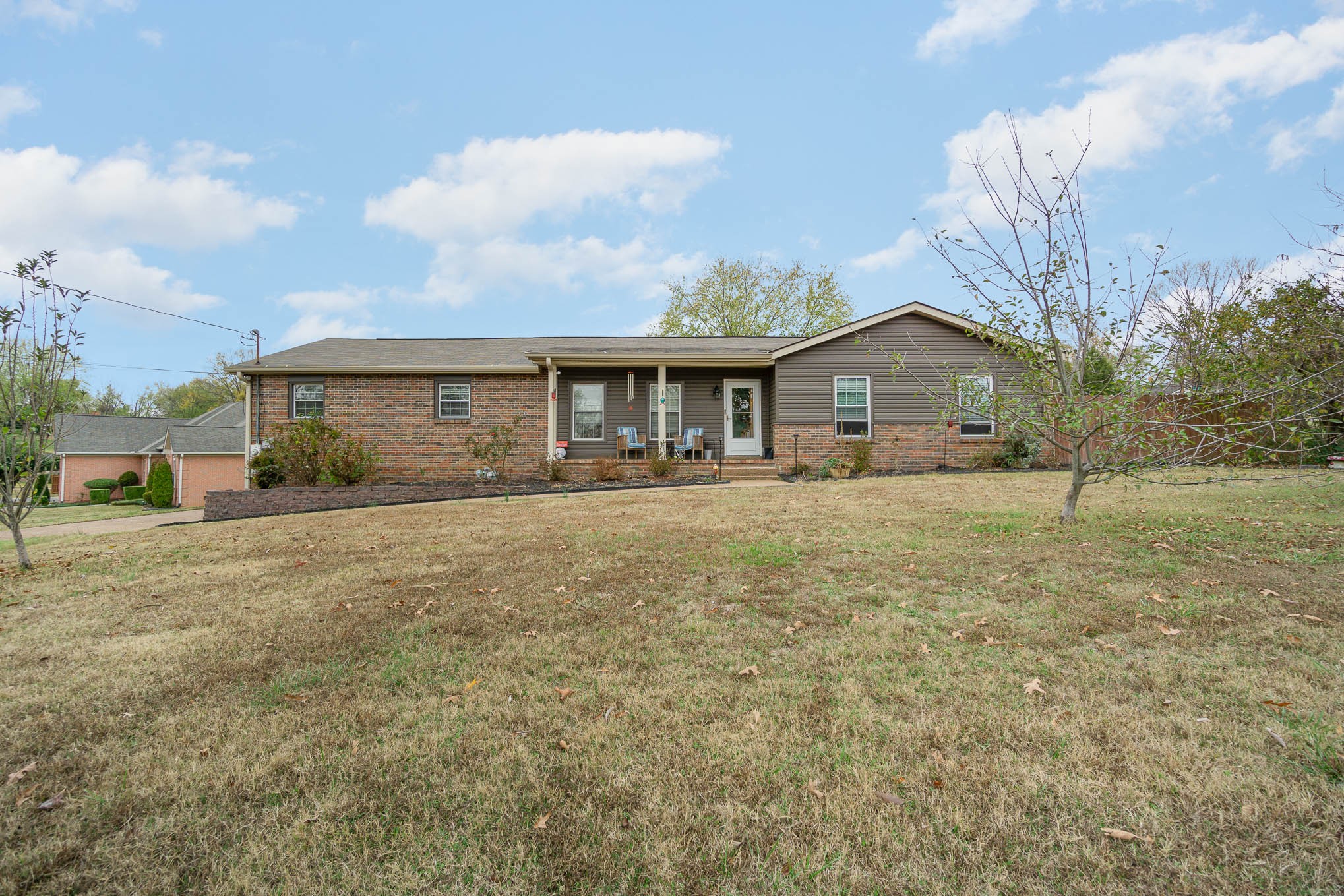 a front view of a house with a yard