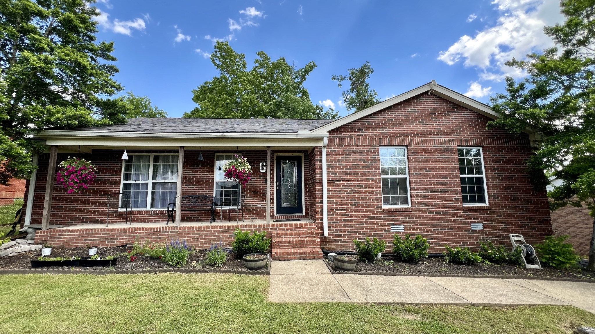 front view of a house with a yard