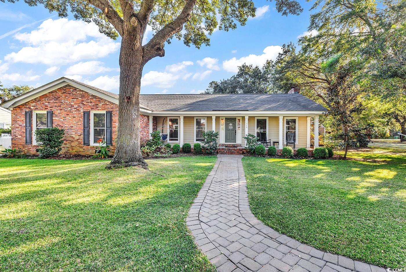 Brick ranch with large front covered porch