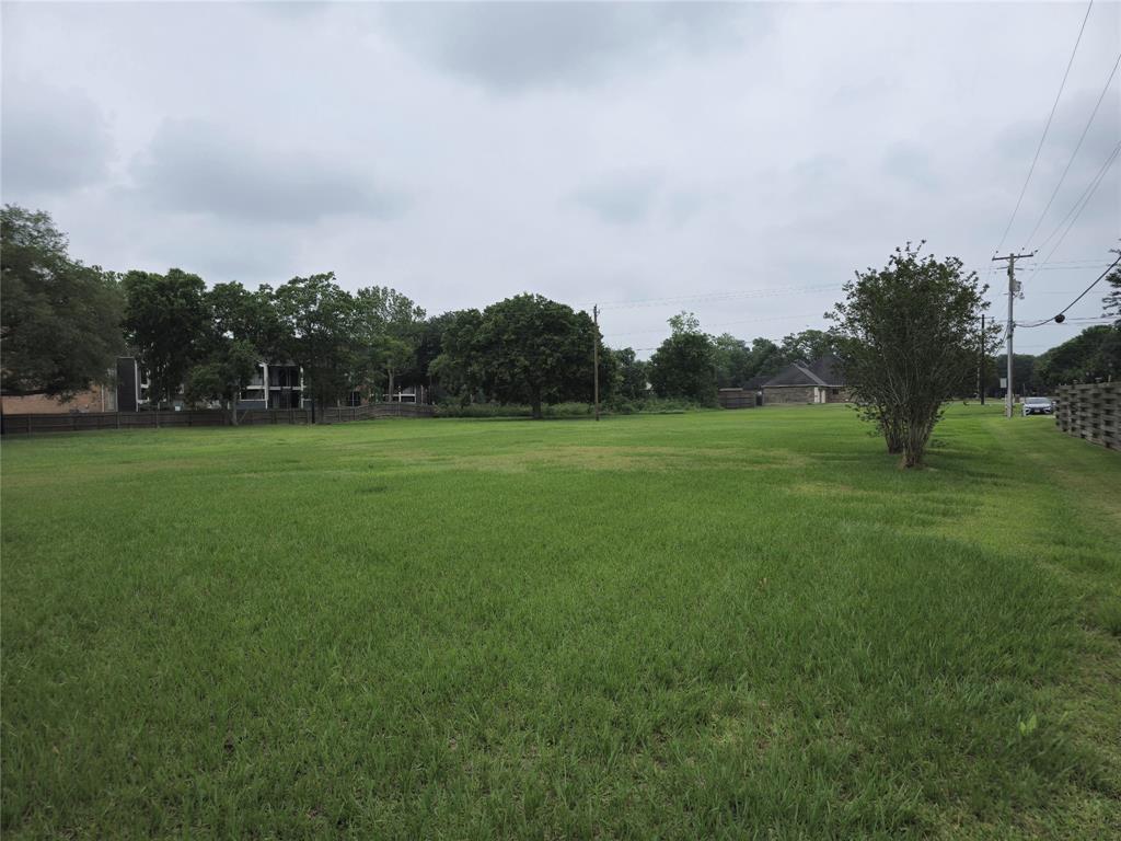 a backyard of a house with lots of green space and fog