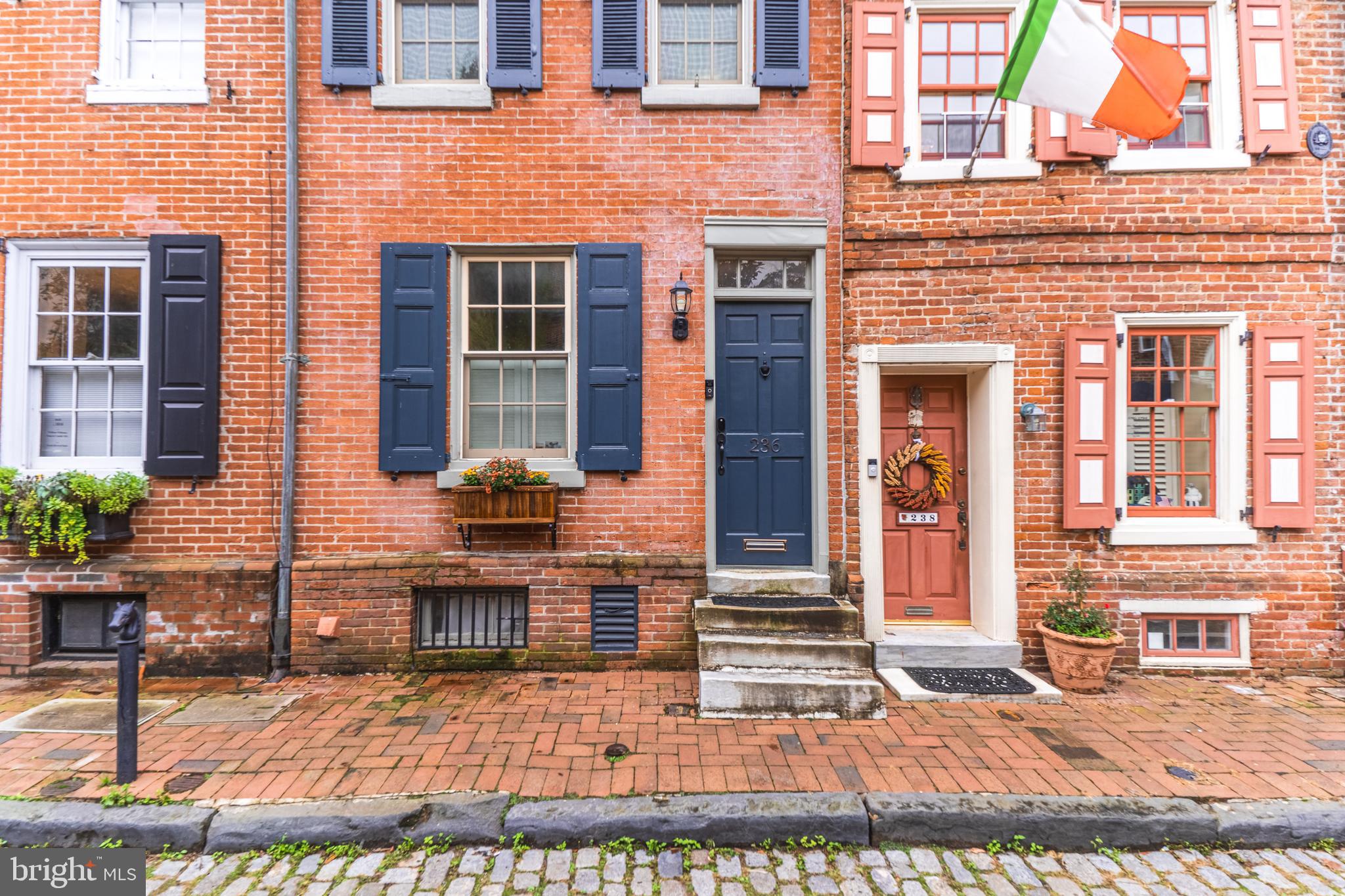 a view of a brick building with many windows