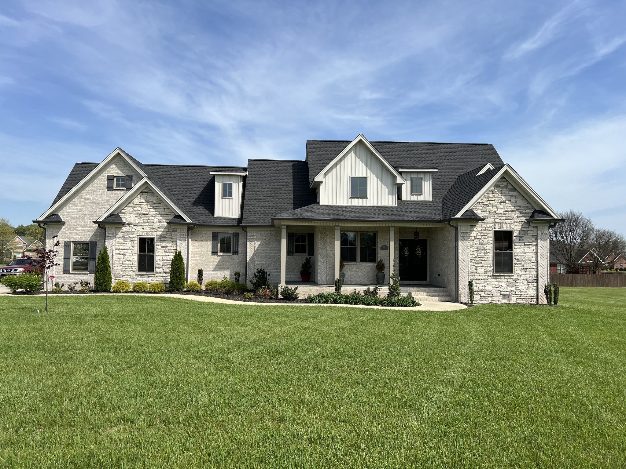 a front view of a house with a yard