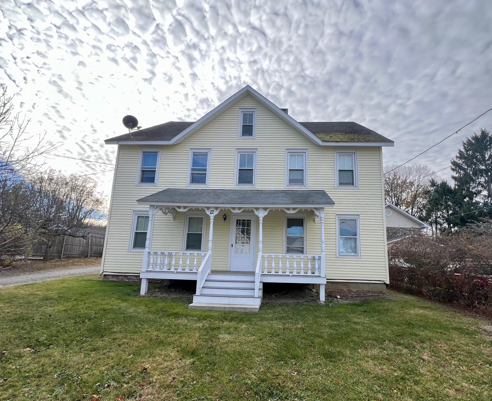 a view of a house with a yard