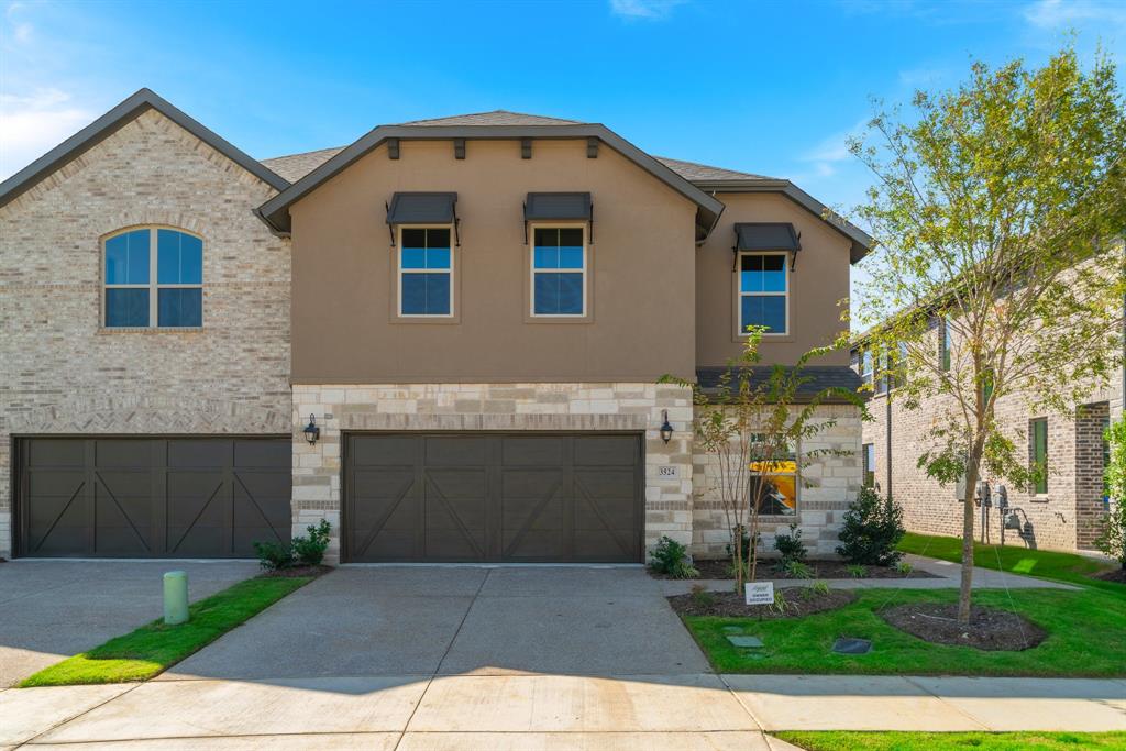 View of front of property with a garage