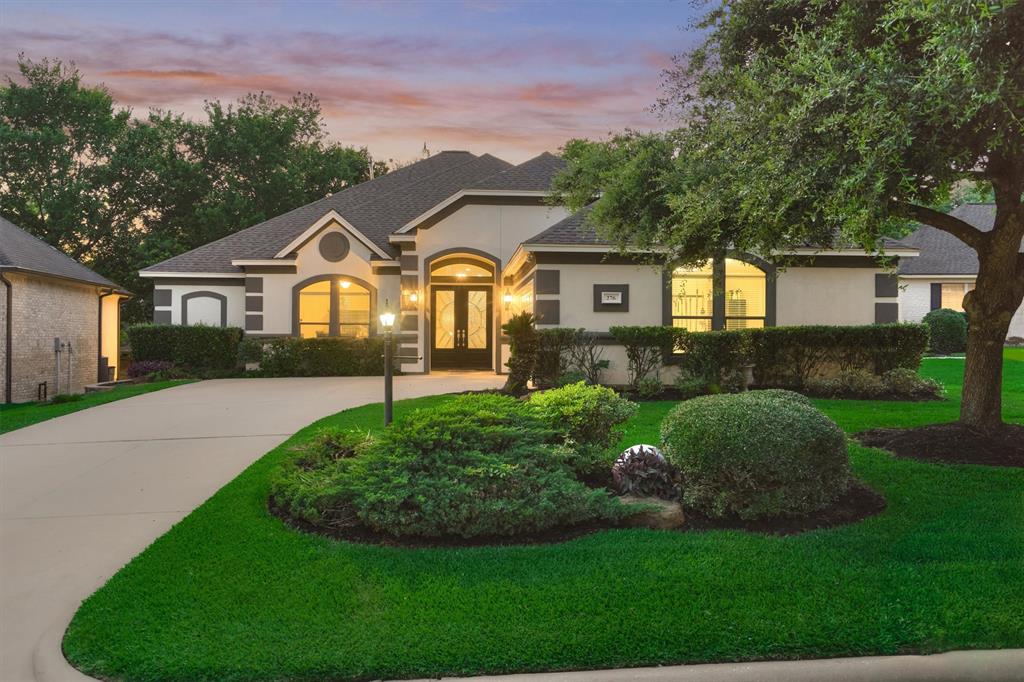 Welcome to 276 Camden Hills Drive, where a meticulously cared for lawn greets you.