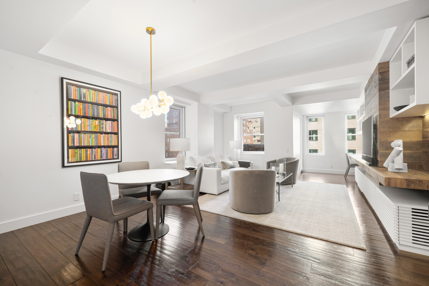 a view of a dining room with furniture window and wooden floor