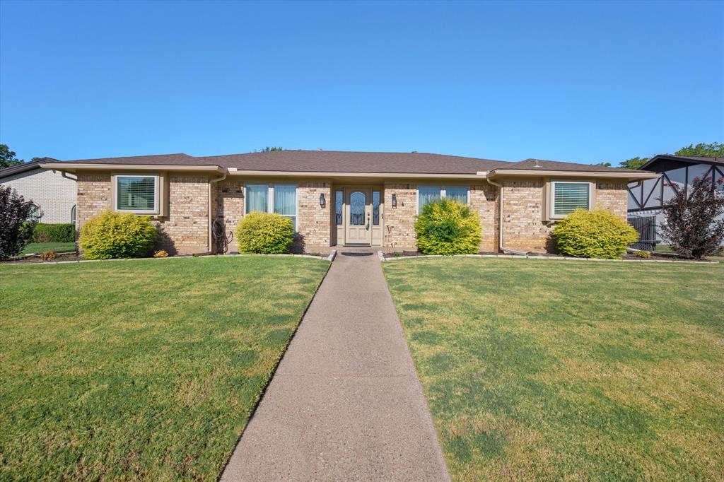 a view of house in front of yard