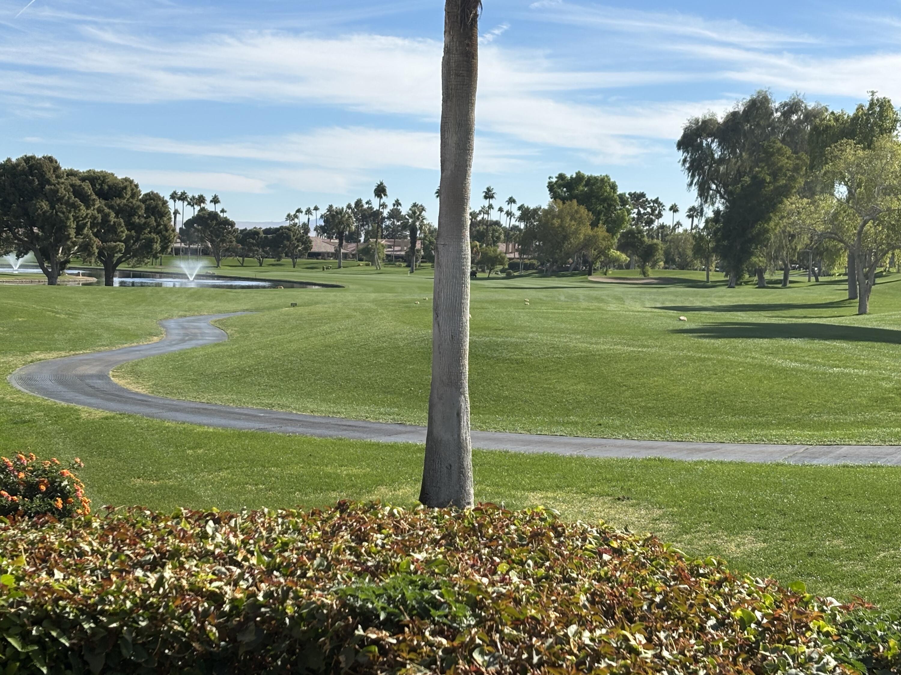 a view of a golf course with a big yard