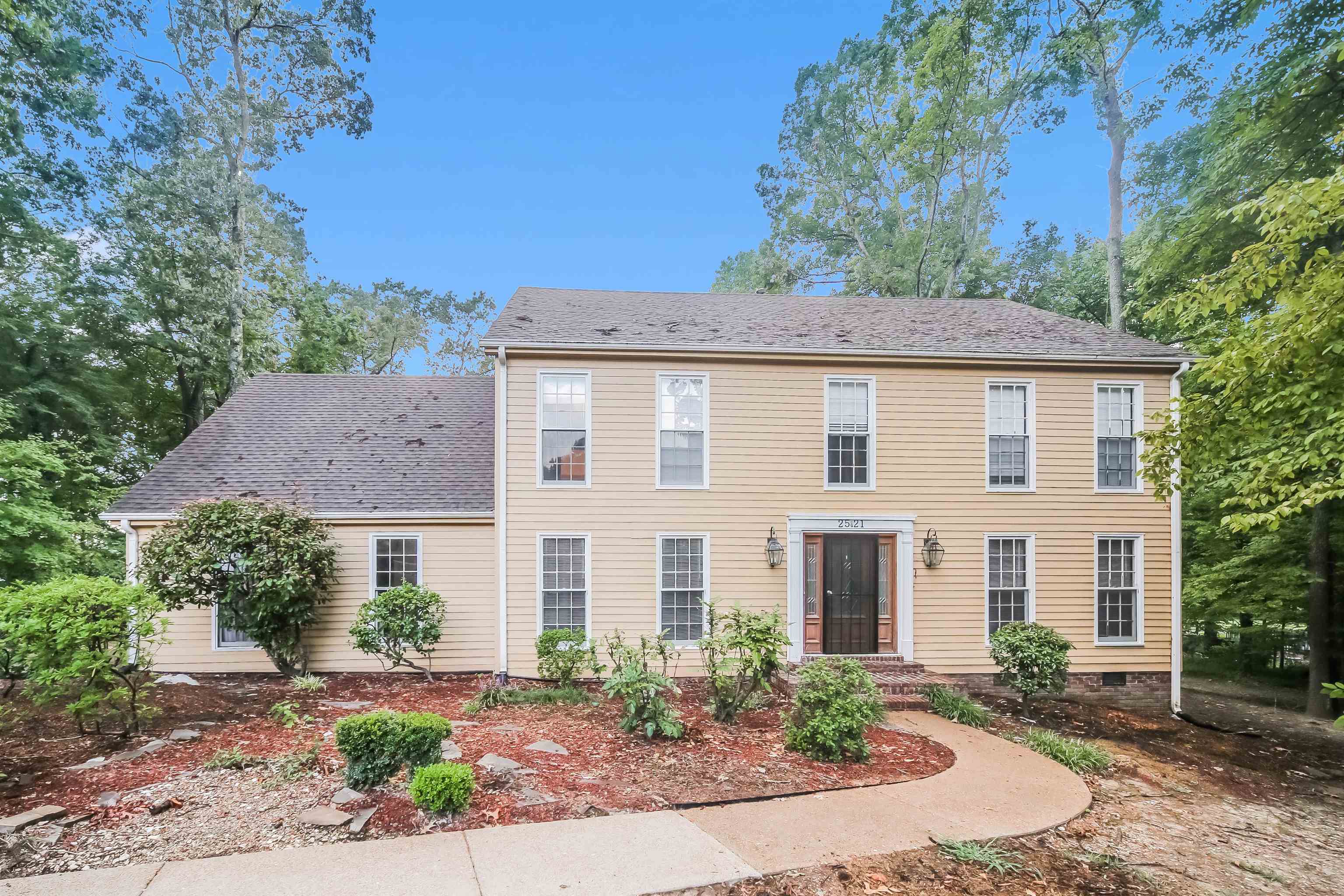 front view of a house with a yard