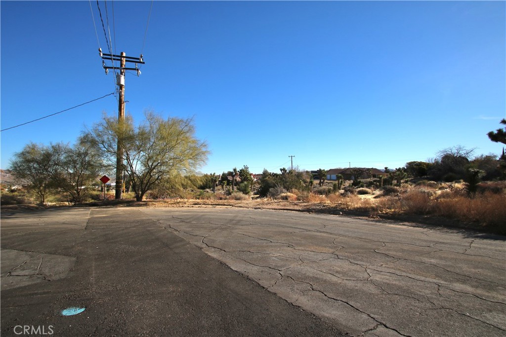 a view of a road with a building in the background