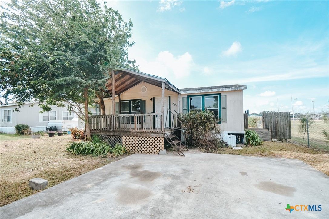 a view of a house with a patio