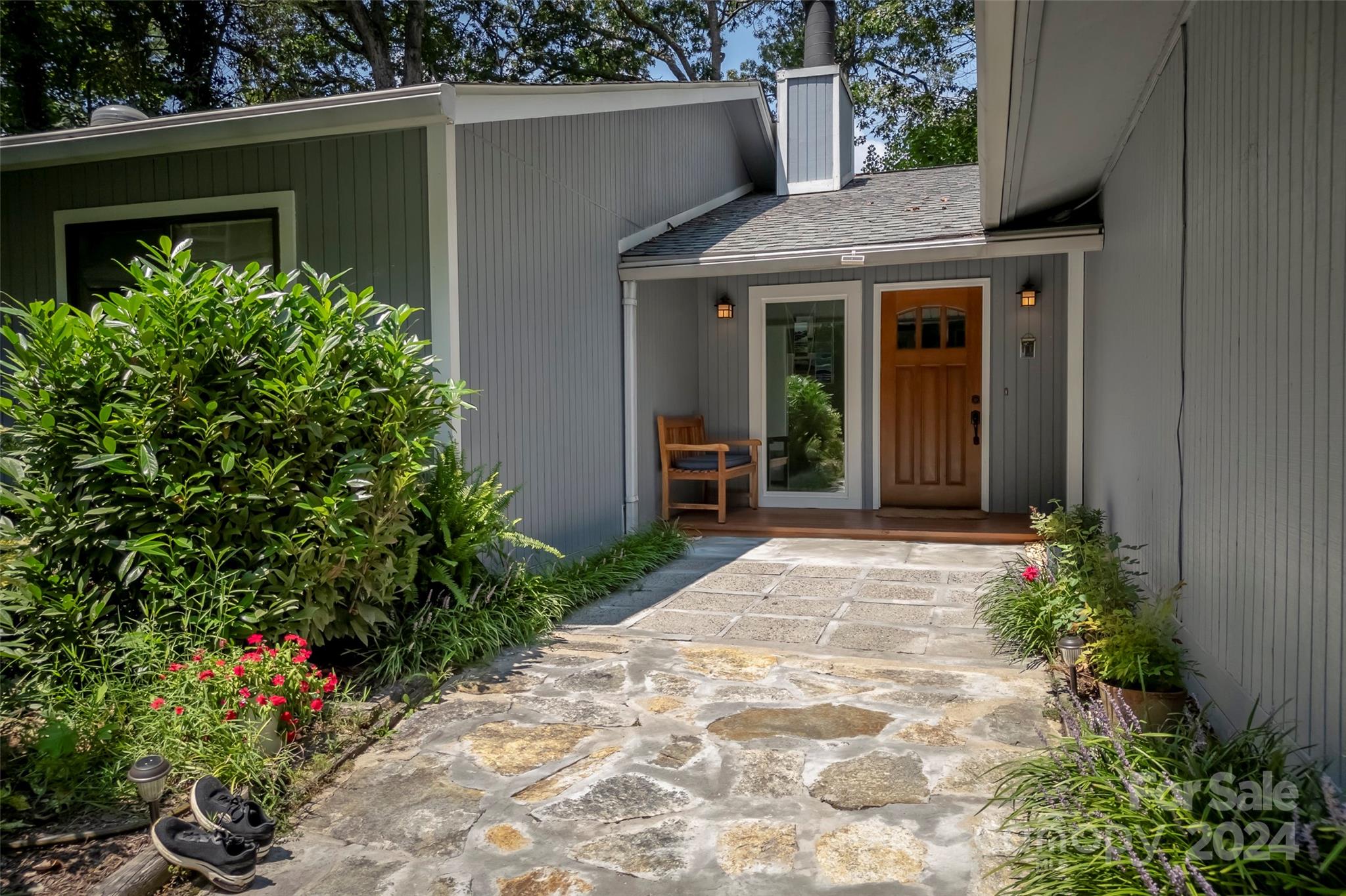 a front view of a house with garden