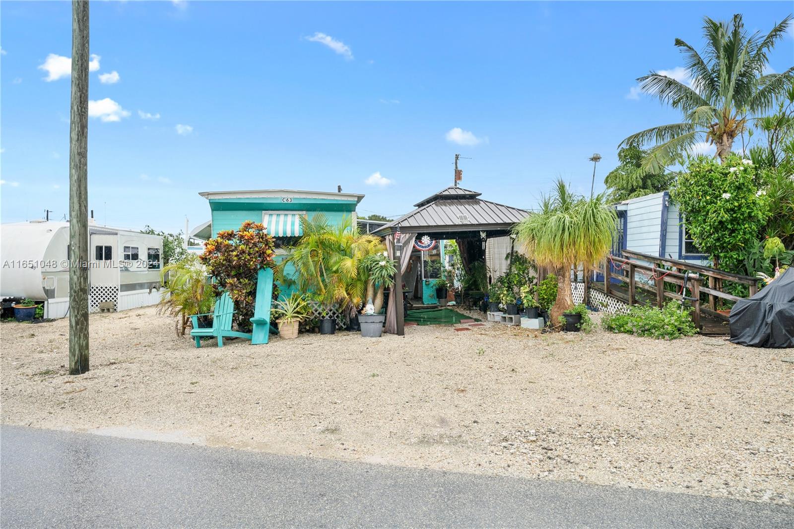 a view of a house with potted plants