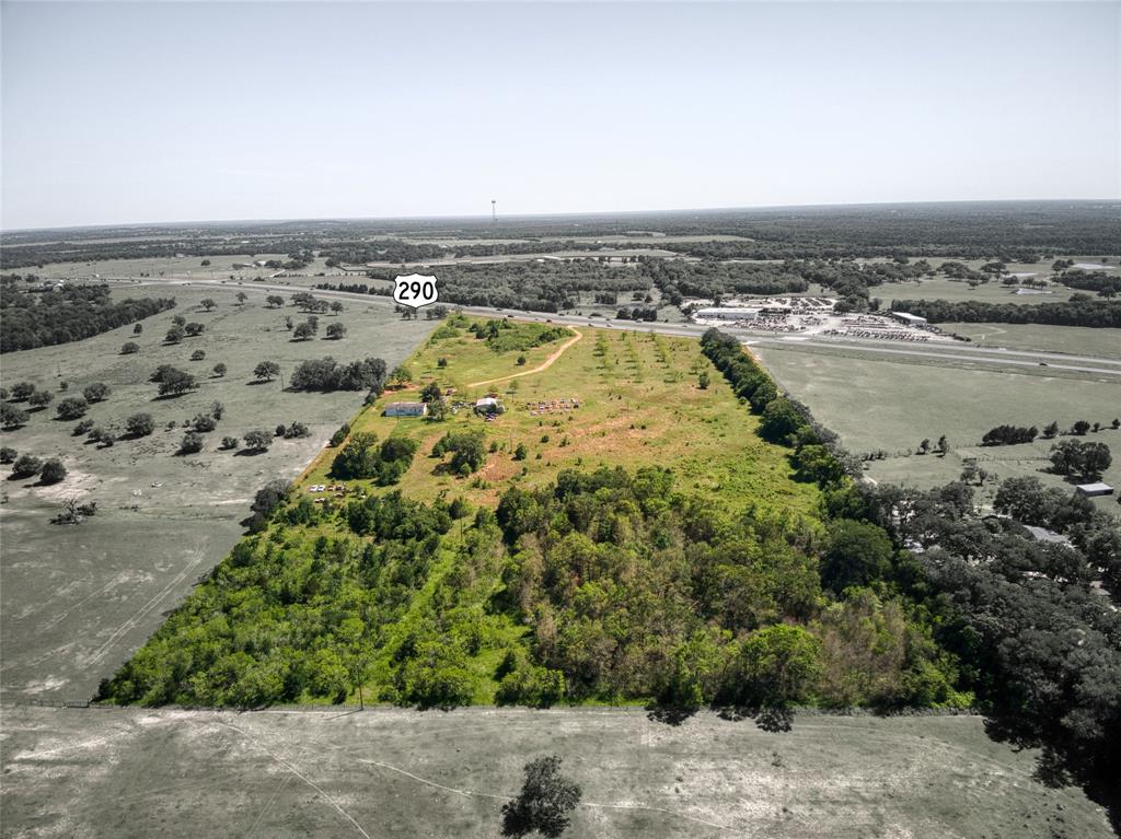 an aerial view of a house with a lake view