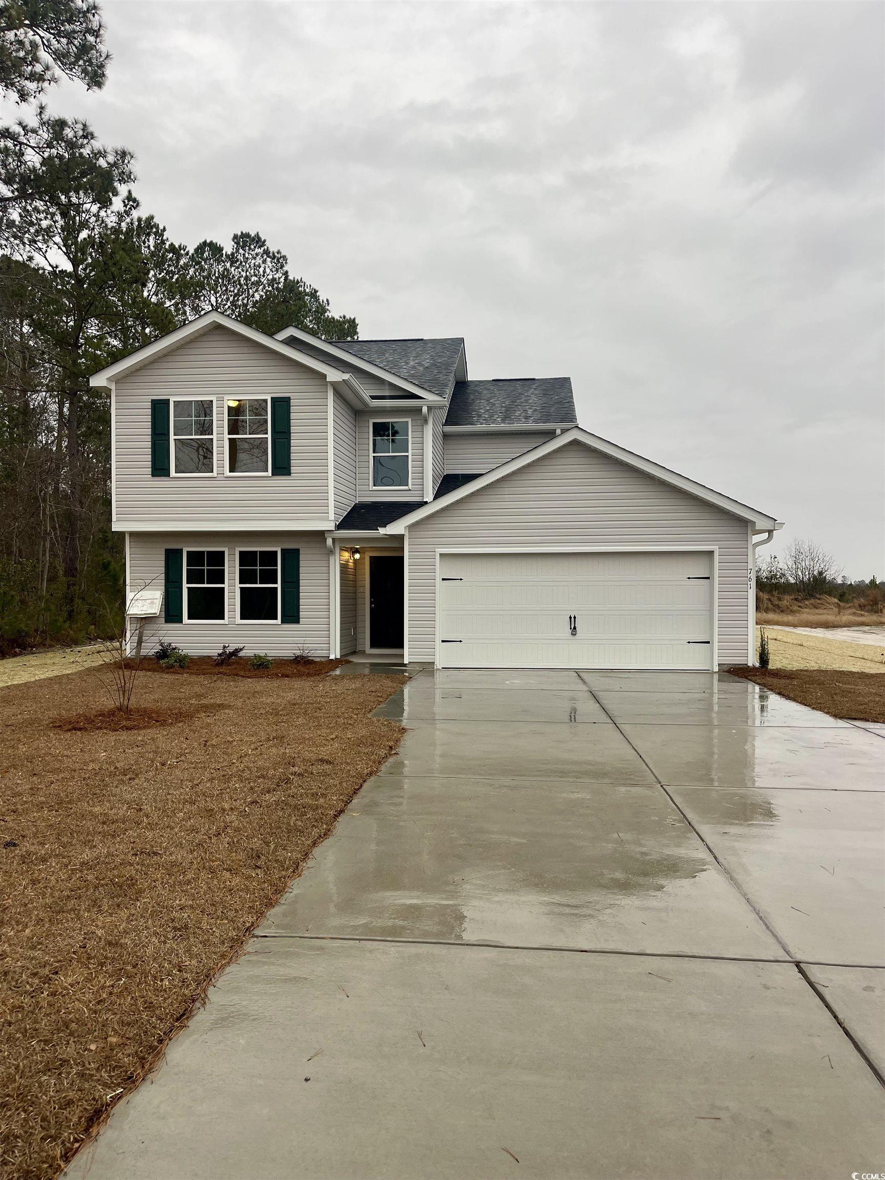 View of front of property with a garage