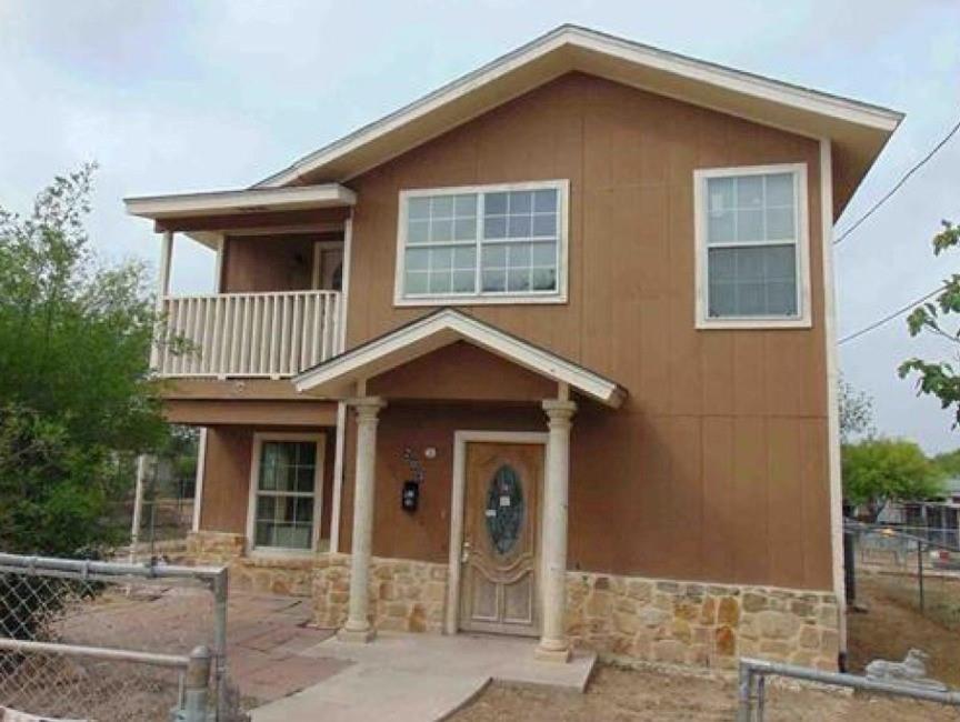 a front view of a house with a porch