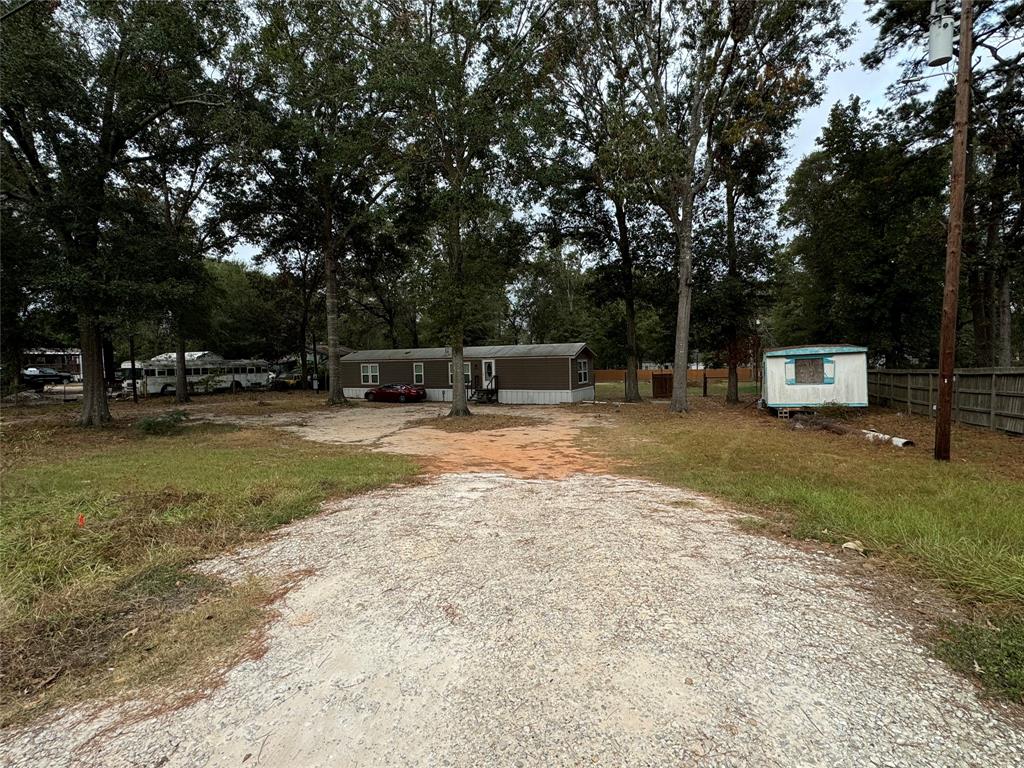 a view of outdoor space with garden and trees