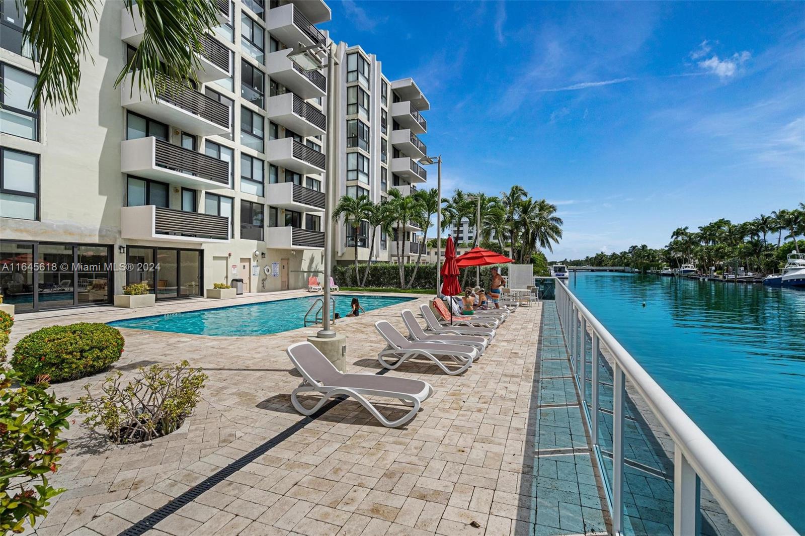 a view of a swimming pool with lounge chair