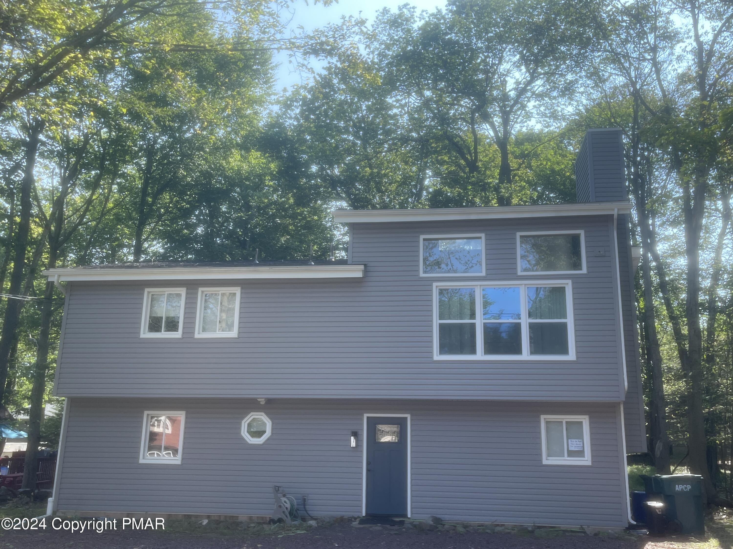 a front view of a house with garage