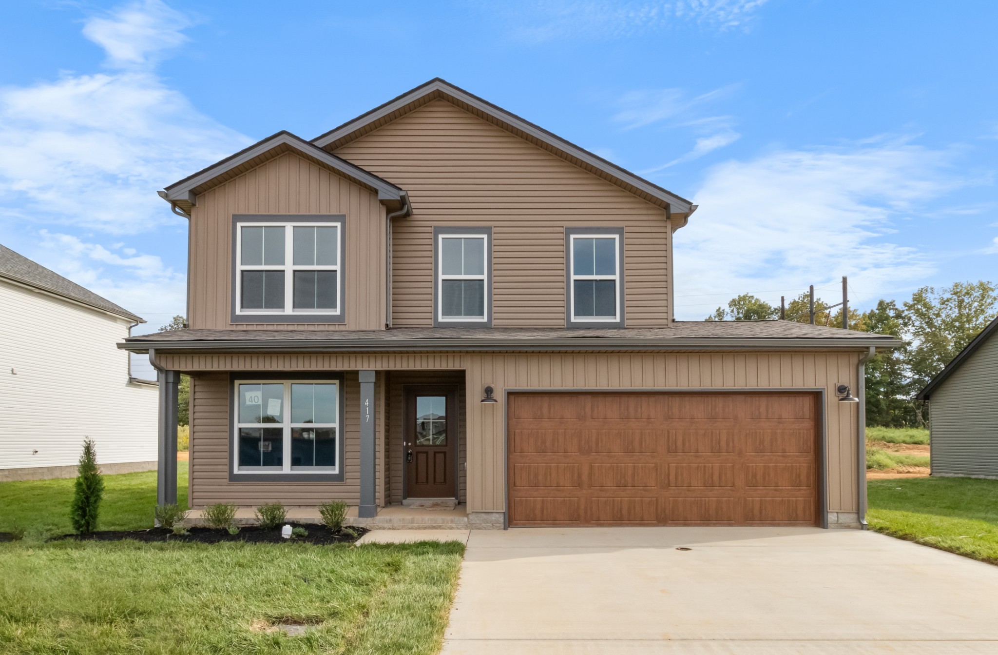 a front view of a house with a yard