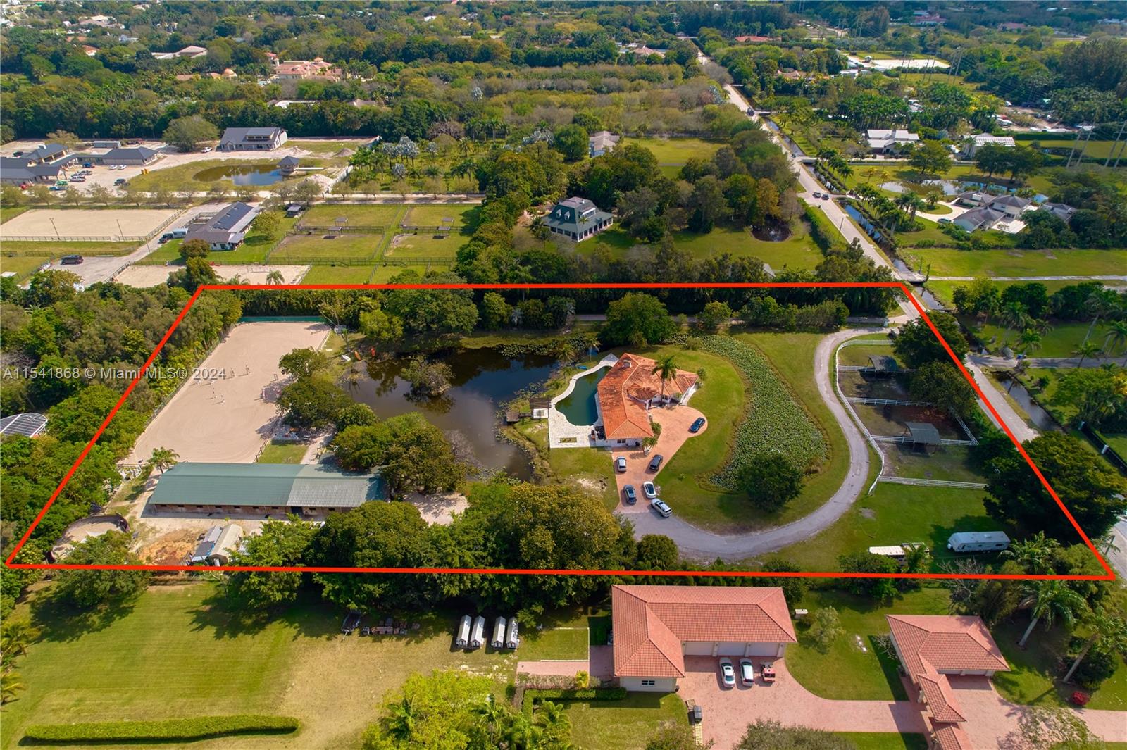 an aerial view of house swimming pool and outdoor space