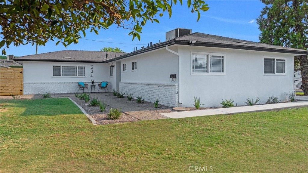 a view of a house with a yard