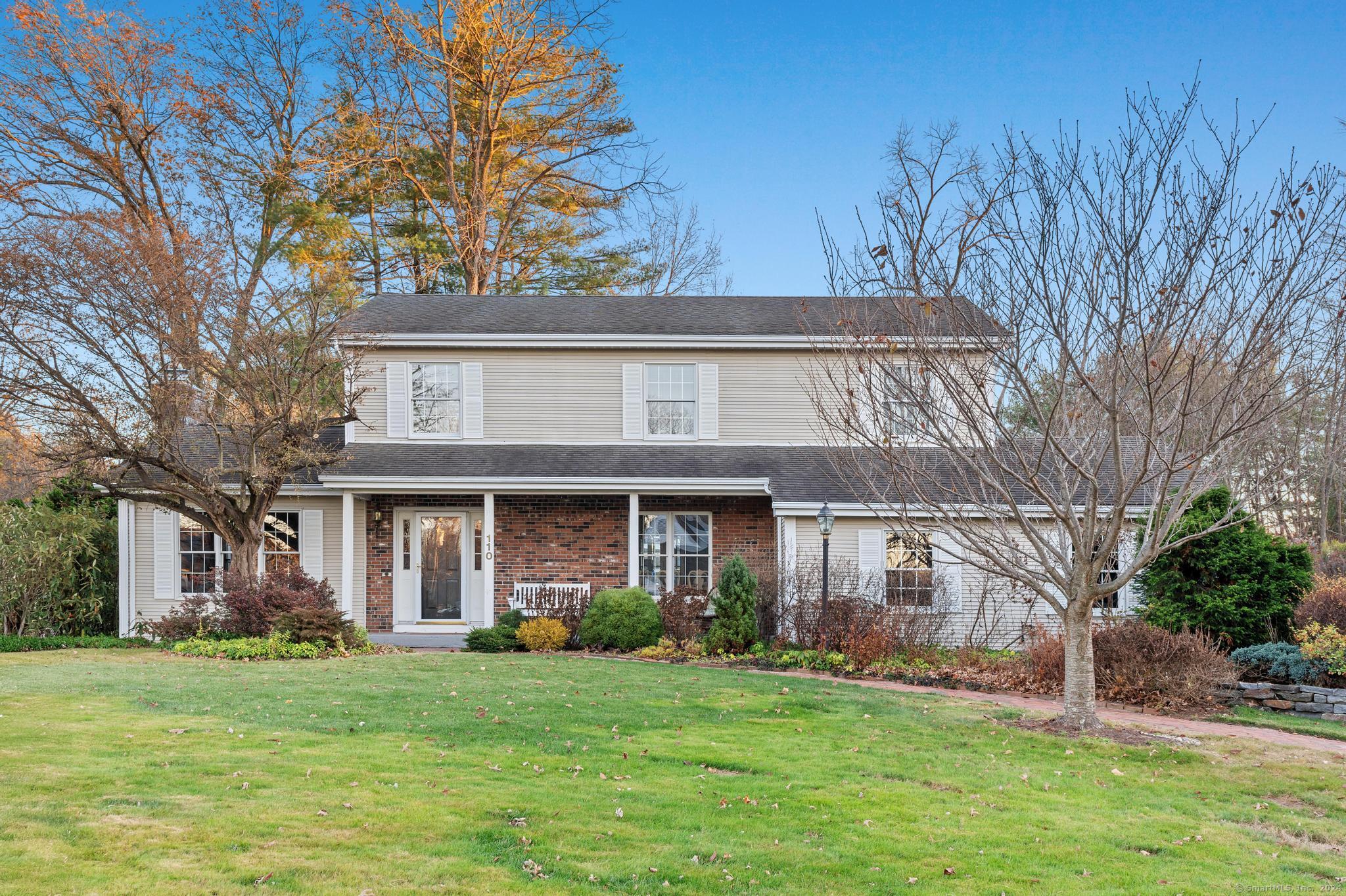 front view of a house with a yard