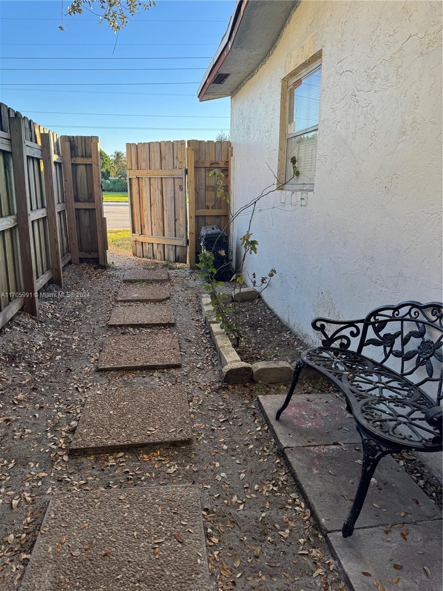 a view of a backyard of the house